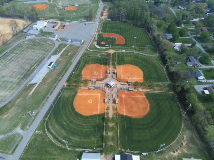 Overhead image of the 4 baseball fields with a larger baseball field in background